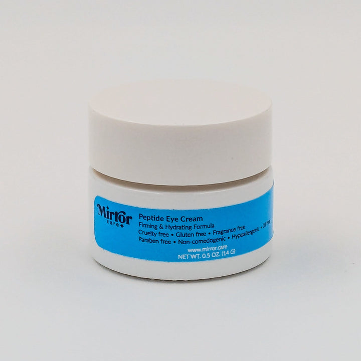 A container of Peptide Eye Cream with Mirror Care blue label against a white background.
